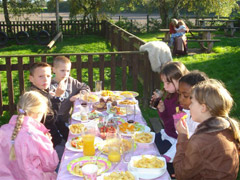 Chip trekking photo of children eating chips & soft drinks